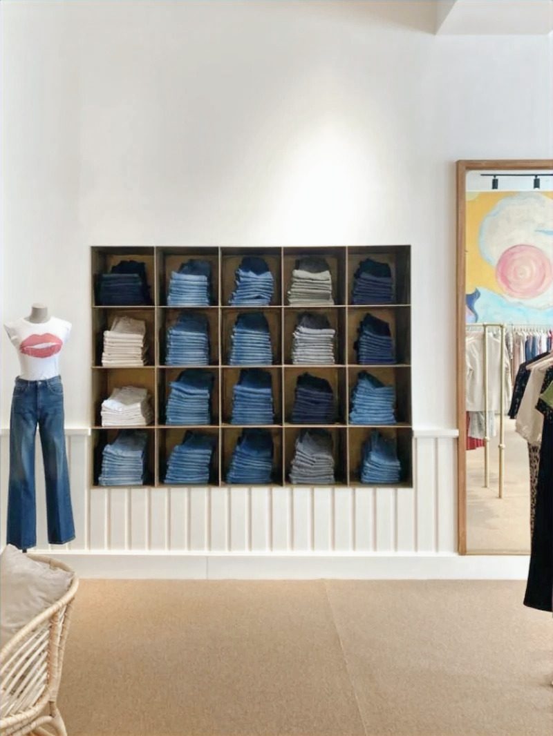 Custom denim wall unit: grid of open cubbies in high-gloss w